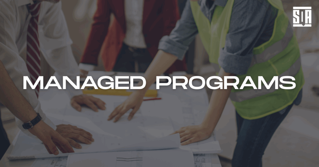 Engineers collaborating over a technical schematic with the title 'Managed Programs' overlayed on the image.
